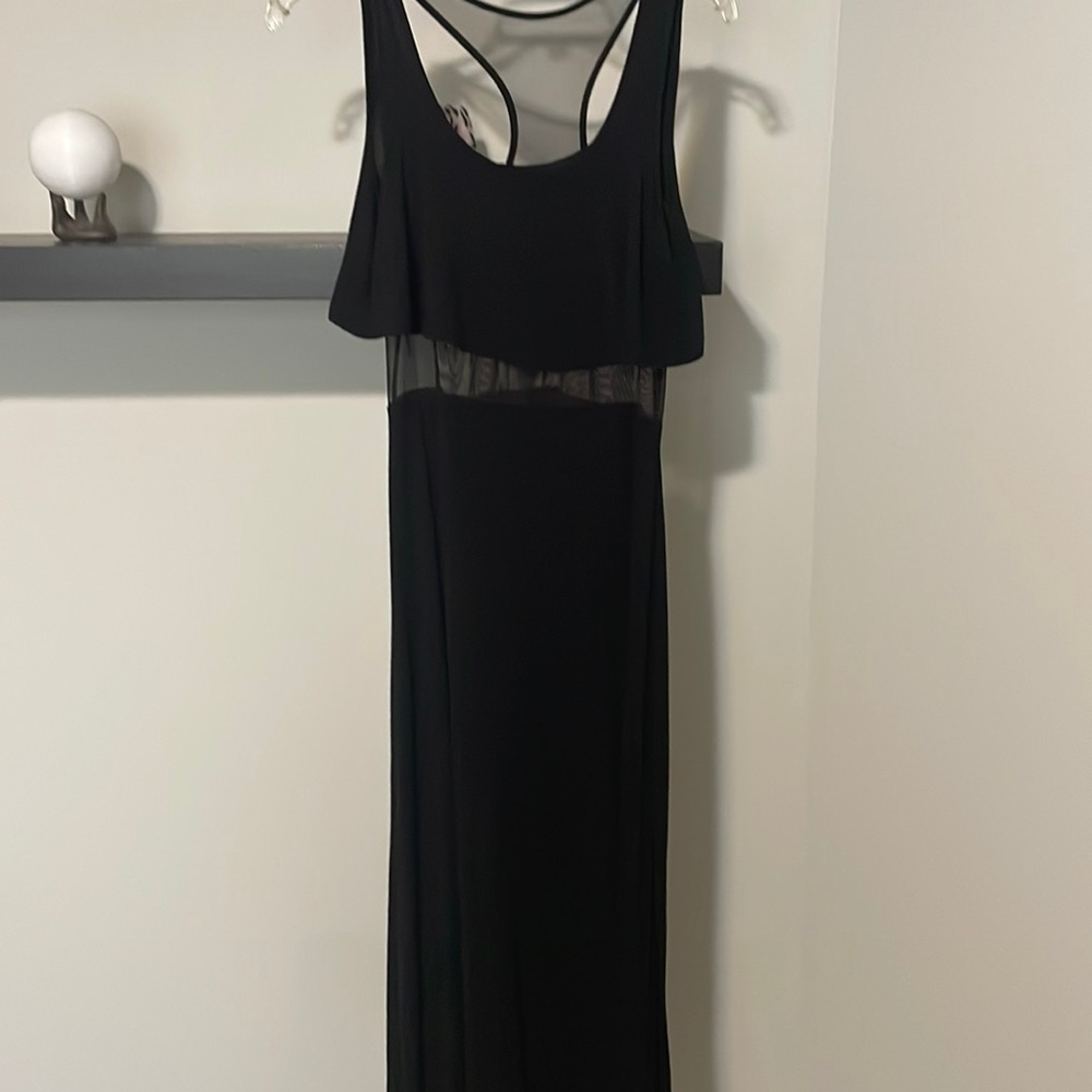 Black sleeveless maxi dress with mesh around waist and part of the back